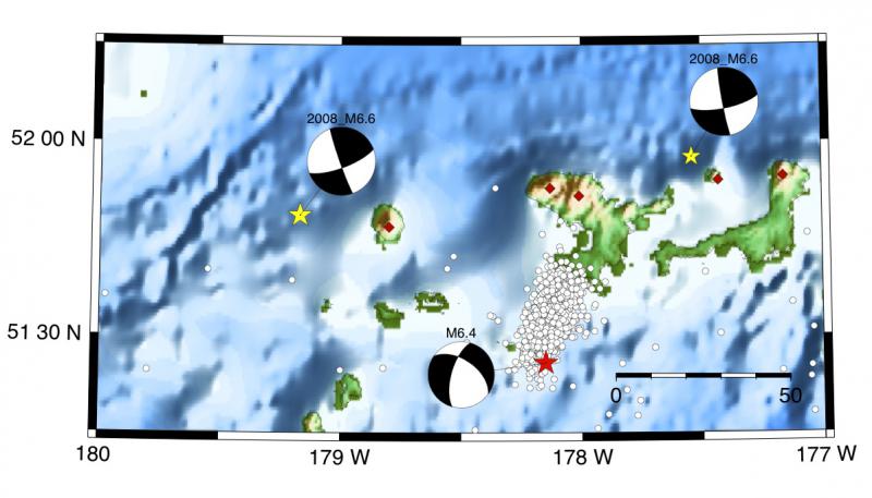 Three focal mechanisms around the perimeter of a cluster of earthquakes.