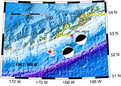 Two focal mechanisms and a cluster of earthquakes south of the Fox Islands.