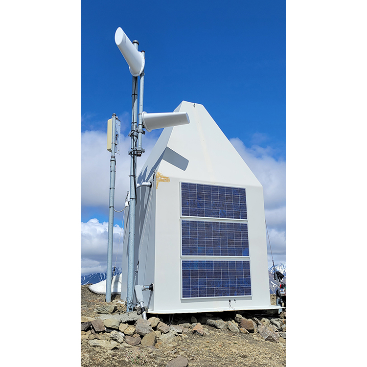 Station hut with two types of radio antennas.