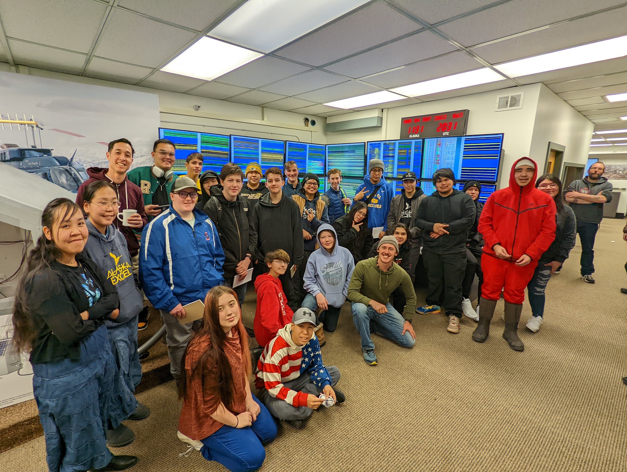 Group of students in front of seismograph screen displays.