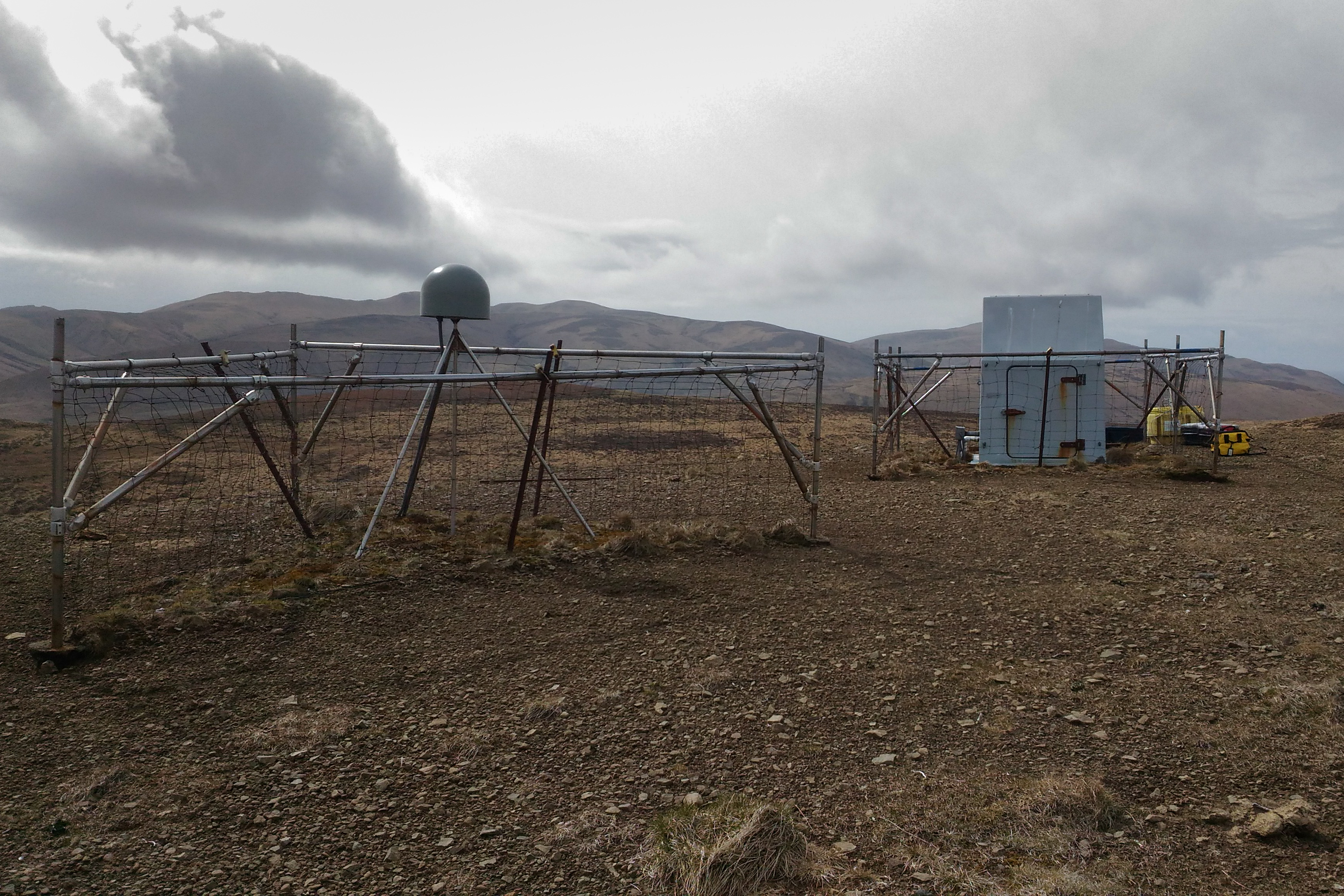 Fences around GPS station and seismic station hut. 